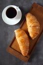 Two fresh croissants and cup of coffee Royalty Free Stock Photo