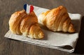 Two fresh croissants on a table Royalty Free Stock Photo