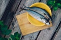 two fresh fish on a cutting Board, cooking mackerel,fish tails close up Royalty Free Stock Photo