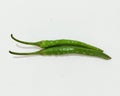 Two fresh green chili peppers on white Royalty Free Stock Photo