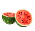 Two fresh, juicy and organic halves of watermelon with seeds, isolated on a white background. A watermelon full of vitamins. Royalty Free Stock Photo