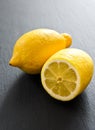 Two fresh lemons on black background Royalty Free Stock Photo