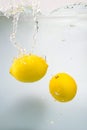 Two Fresh lemons in water splash on white Royalty Free Stock Photo