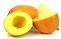 Two fresh mango fruits with one cut Royalty Free Stock Photo