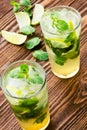 Two fresh mojitos cocktail. Mojitos with mint leaves, lime and i