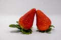 Two fresh and natural organic strawberries totally full of vitamins with white background. Royalty Free Stock Photo
