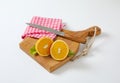 Two fresh orange halves on cutting board Royalty Free Stock Photo