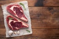 Two fresh raw marble meat, black Angus ribeye steak with spices on a old rustic table. Raw beef on a wooden background. Top view w Royalty Free Stock Photo