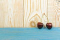 Fresh Overripe ripe Cherries on Blue Rustic Wooden Background Royalty Free Stock Photo