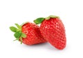 Two fresh ripe strawberries on a white background