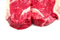 Two fresh strip loin steaks on a white isolated background.