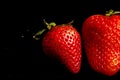 Two fresh sweet red strawberry`s with there seed`s showing Royalty Free Stock Photo