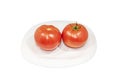 Two fresh tomatoes on white plat. Clipping Path