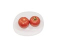 Two fresh tomatoes on white plat. Clipping Path