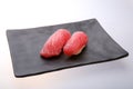 Two fresh tuna sushi on a black dish Royalty Free Stock Photo