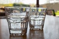 Two freshly poured glasses of sparkling water on wood table. Royalty Free Stock Photo