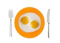 Two fried eggs on orange plate, knife and fork isolated on white Royalty Free Stock Photo