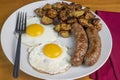 two eggs with homefries and sweet italian sauage