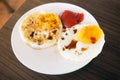 Two fried eggs with tomato sauce and soy sauce in white plate on