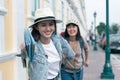 Two friend young beautiful women traveler happy running outdoor explore sight seeing. Friends having a happy and fun time in Royalty Free Stock Photo