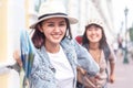 Two friend young beautiful women traveler happy running outdoor explore sight seeing. Friends having a happy and fun time in Royalty Free Stock Photo