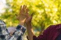 two friends beat high five outdoors on a summer day, friendship success relationships Royalty Free Stock Photo