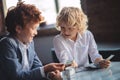 Two friends counting saved money and looking excited Royalty Free Stock Photo