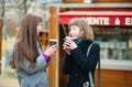 Two friends drinking coffee outdoors Royalty Free Stock Photo