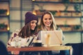 Two friends enjoying coffee together in a coffee shop Royalty Free Stock Photo