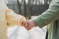 Two women friends or female partners meet on street. Handshake of Successful business women on the background of modern Royalty Free Stock Photo