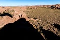 Two friends figures shades dancing stone boulder rock, Bolivia. Royalty Free Stock Photo