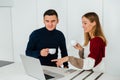 Two friends having conversation while looking at laptop screen Royalty Free Stock Photo