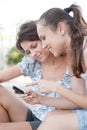 Two friends looking at cellphone Royalty Free Stock Photo