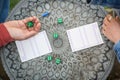 The Couple playing Yahtzee game in free time, outdor Royalty Free Stock Photo