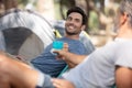 two friends out camping cheers with coffee mug Royalty Free Stock Photo