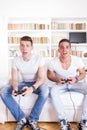 Two friends playing video games Royalty Free Stock Photo