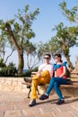 Two friends relaxing on the bench after a stroll Royalty Free Stock Photo