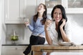 Two friends relaxing in the kitchen Royalty Free Stock Photo