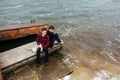 Two friends relaxing on the pier. Royalty Free Stock Photo