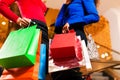 Two friends shopping in Mall with bags Royalty Free Stock Photo