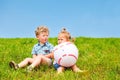 Two friends sitting on grass Royalty Free Stock Photo