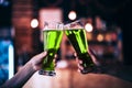Two friends toasting with glasses of green beer Royalty Free Stock Photo