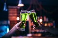 Two friends toasting with glasses of green beer Royalty Free Stock Photo