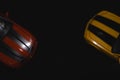 Two front parts of two american muscle cars seen from above on a black background. Royalty Free Stock Photo