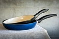Two frying pans with black pens Royalty Free Stock Photo