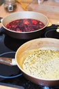 Two frying pans on a plate with sauce and berries Royalty Free Stock Photo