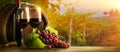 Two full glasses of red wine on wooden table, grappe and barrel in autum italy tuscany  landscape background Royalty Free Stock Photo