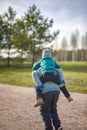 Two funny boys-brother and friend, walking together in the spring park, running, jumping and enjoying Royalty Free Stock Photo