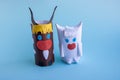 Two funny bulls made of paper and toilet roll on a blue background.New year`s fantasy