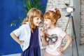 Two funny children sing a song in karaoke. The concept is childh Royalty Free Stock Photo